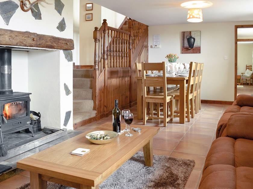Spacious lounge with wood burning fire and dining area | Ty Hir - Bwlchgwyn Equestrian Holidays, Arthog, near Fairbourne