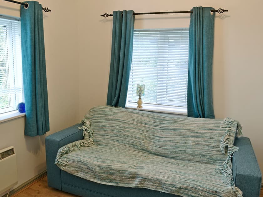 Cosy living area with double futon bed  | The Pocket Watch, Seatown