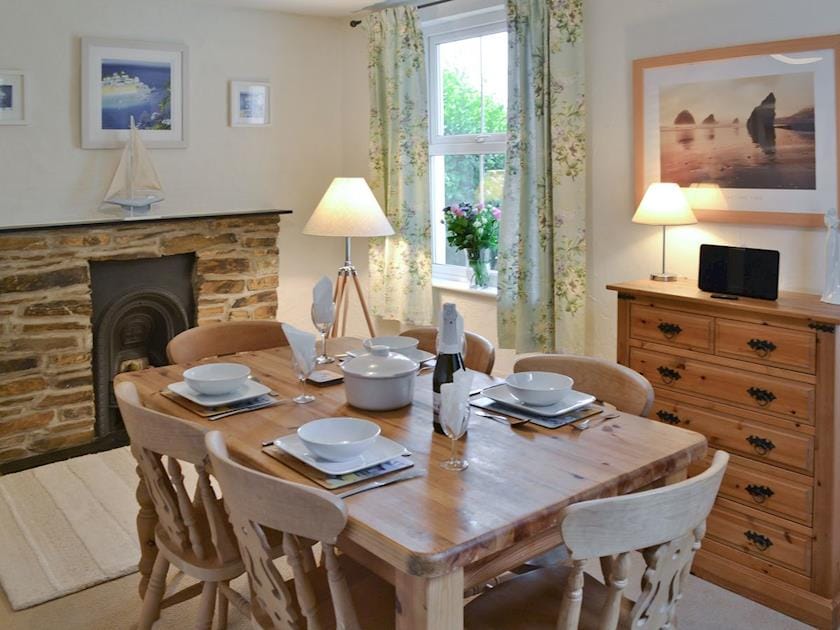 Dining room with heritage fireplace | Hay Cottage, St Austell