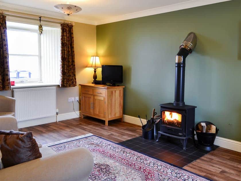 Open plan living space with wood-burning stove | The Parlour - Shodshill Mill Farm Cottages, By Carnwath