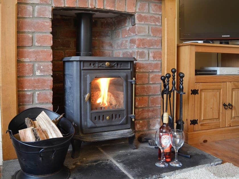 Charming living room with cosy wood burner | Bevan House, Hundred House, near Builth Wells