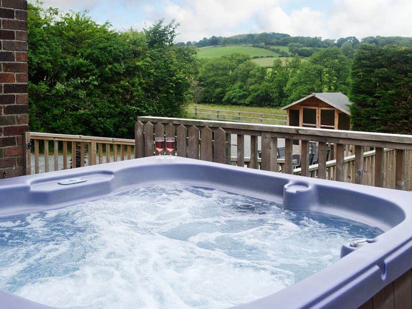 Relax in the private hot tub | Bevan House, Hundred House, near Builth Wells