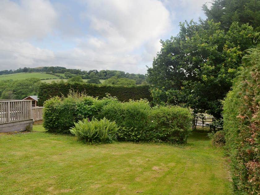 Mainly lawned garden with mature planting | Bevan House, Hundred House, near Builth Wells
