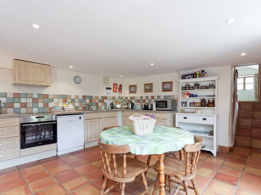 Kitchen with dining table | Old Milking Parlour, Osmington, near Weymouth
