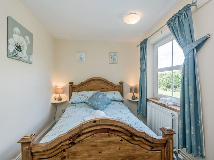 Comfortable double bedroom with river views | Wherryman’s Cottage, Coltishall