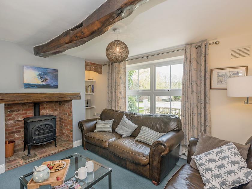Homely living room with inglenook fireplace | Wherryman’s Cottage, Coltishall