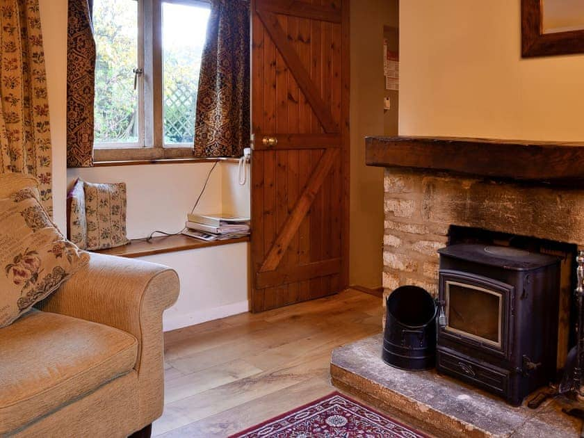 Delightful living room with feature fireplace | The Cot, Bussage, near Cirencester