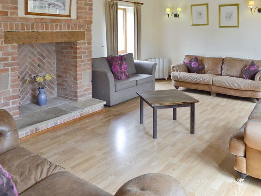 Appealing living room with feature fireplace | The Coach House, Somersal Herbert, near Ashbourne