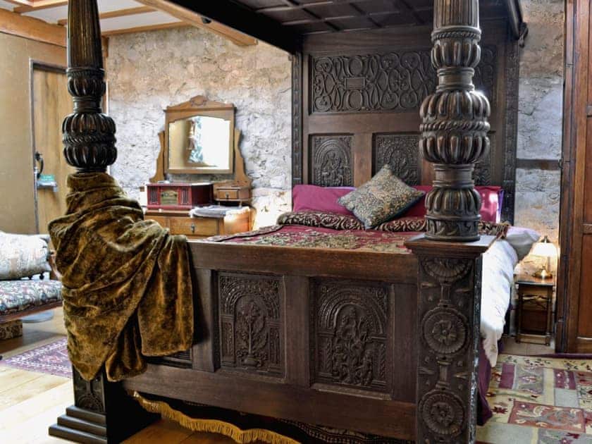 Spectacular, heavily carved, Elizabethan-style four poster bed | Hen Wrych Hall Tower, Abergele, Conwy