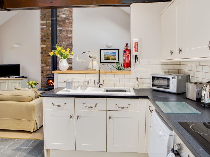 Vaulted ceiling and well-equipped farmhouse-style kitchen area with tiled floor | Scalby Lodge Farm - Springthorpe Cottage - Scalby Lodge, Scalby, Scarborough