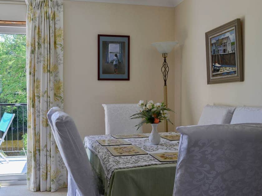 Elegant dining table and chairs with a fantastic view of the river | Riverside, Newton Stewart