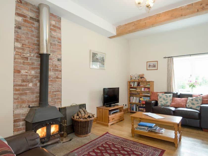 Cosy living room with wood burner | The Stable, Foxham, near Chippenham