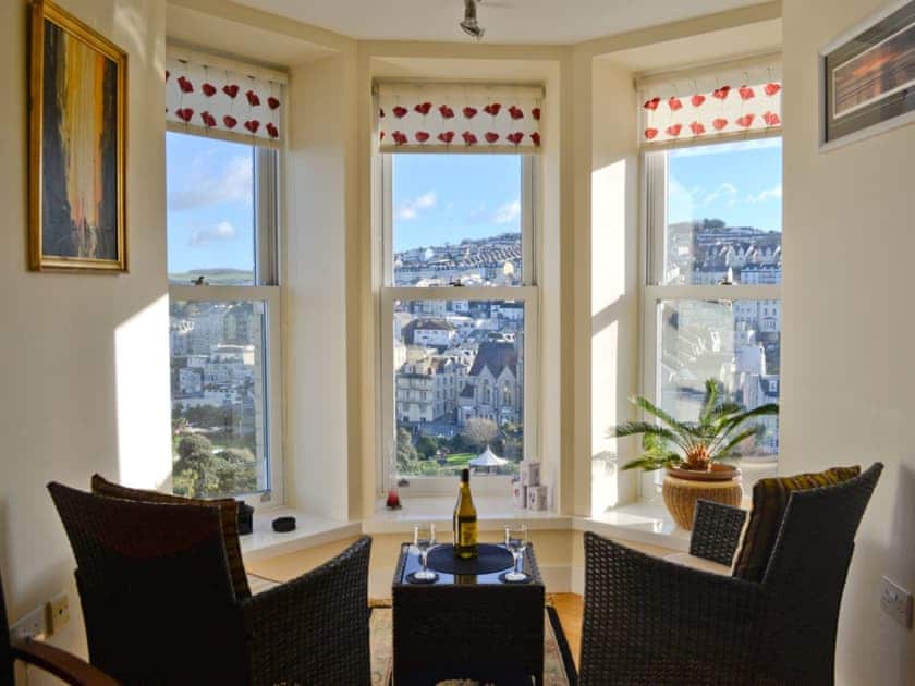 Seating area with fantastic views from the window | Apartment 6, Ilfracombe