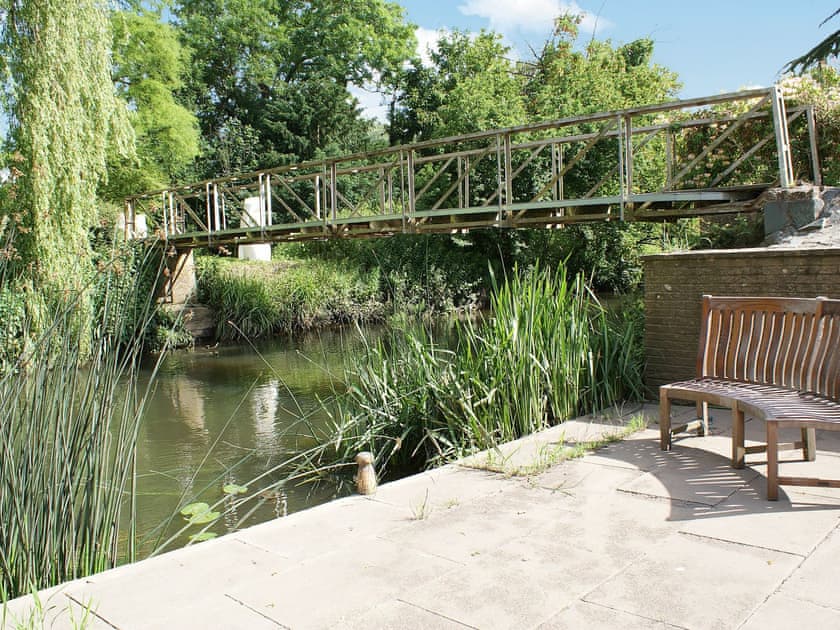 Riverside seating and bridge access to island | The Writing Room, Barford, near Stratford-upon-Avon