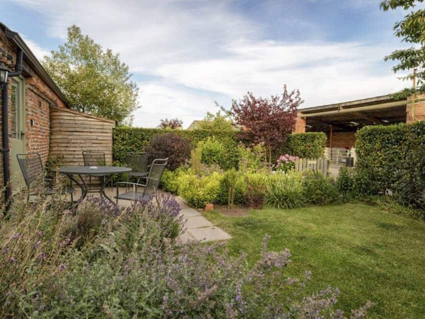 Garden with patio | The Hayloft - Mackinder Farms, Brayton, Selby