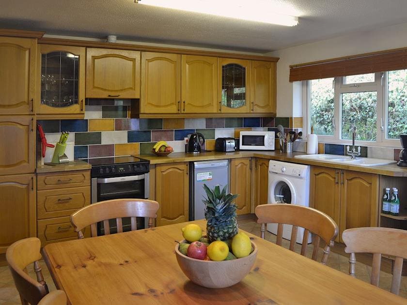 Farmhouse style kitchen/diner with lasrge pine dining table | Ponsgwedhen, Coverack, near Helston