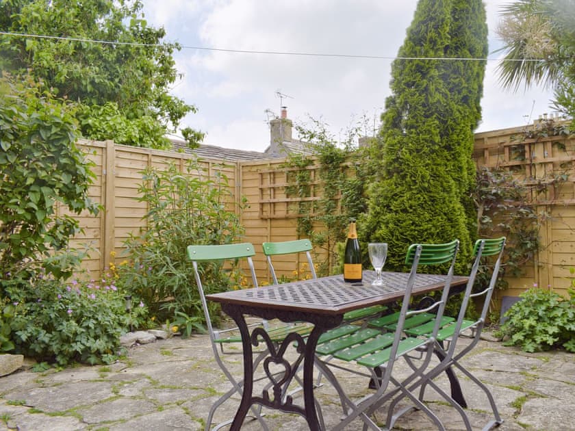 Enclosed courtyard with sitting-out furniture | Herston Rise, Swanage