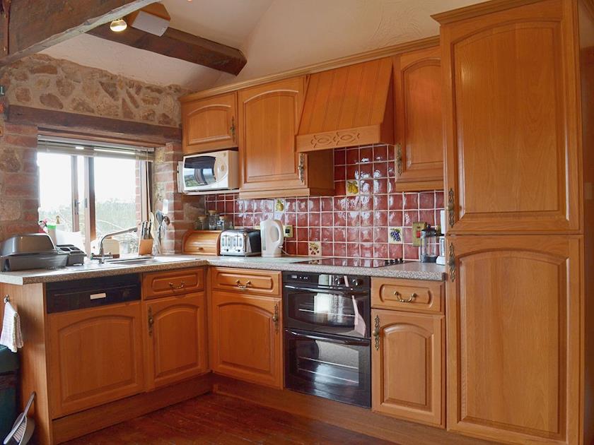 The well-equipped kitchen benefits from Biomass underfloor heating | Whitwell Farm CottagesAshley’s, Whitwell Farm, Colyford, near Seaton