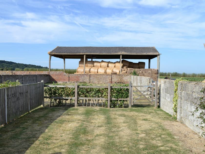 View from patio over lawned garden | The Stable - Decoy Farm Holiday Cottages, High Halstow, near Rochester