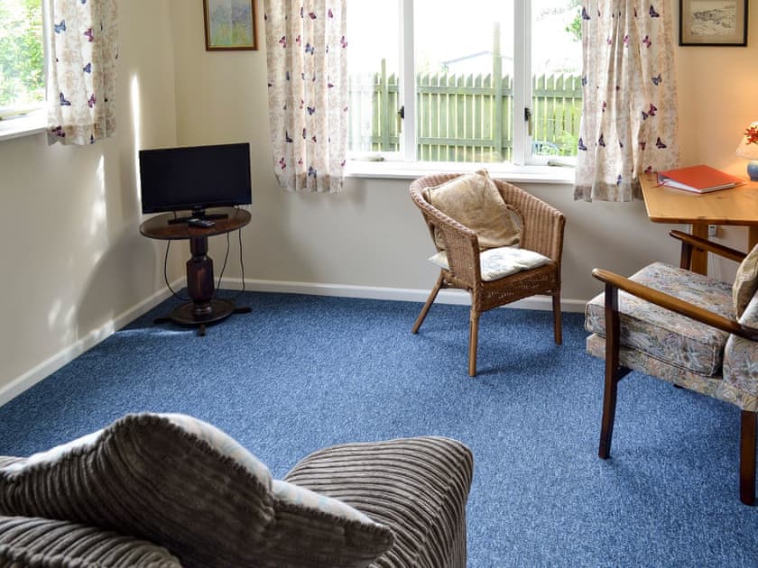 Lounge area with dining table | Heather Brae Lodge, Nancledra, near Penzance