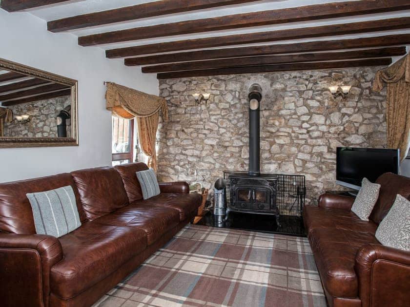 Living room with wood burner | Honeysuckle Cottage, Matlock
