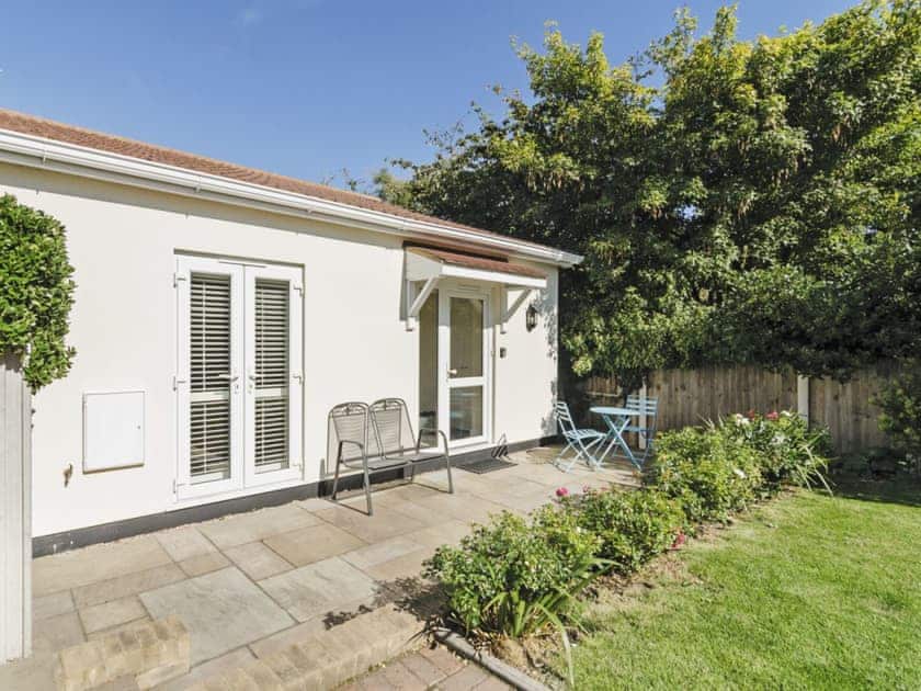 Enclosed lawned garden with terrace  | Owls Croft, Broadstairs