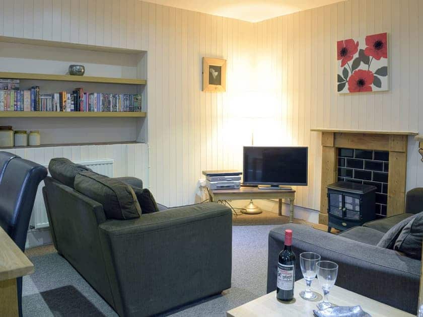 Cosy seating area within open-plan living space | Lake Cottage - Ivy Court Cottages, Llys-y-Fran