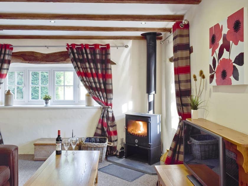 Traditional lounge with wood beamed ceiling | Carthouse Cottage - Ivy Court Cottages, Llys-y-Fran