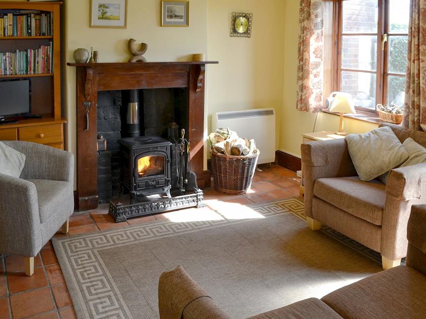 Cosy living room with multi fuel burner | Lanthorn Cottage, Happisburgh
