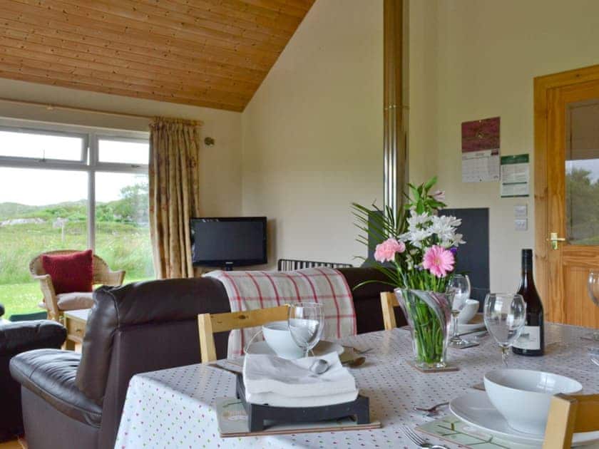 Dining area within open-plan living room | Riverview Cottage, Acharacle