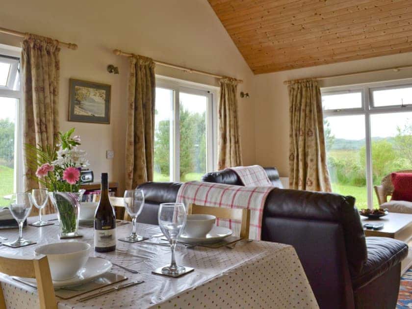 Dining area within open-plan living room | Riverview Cottage, Acharacle