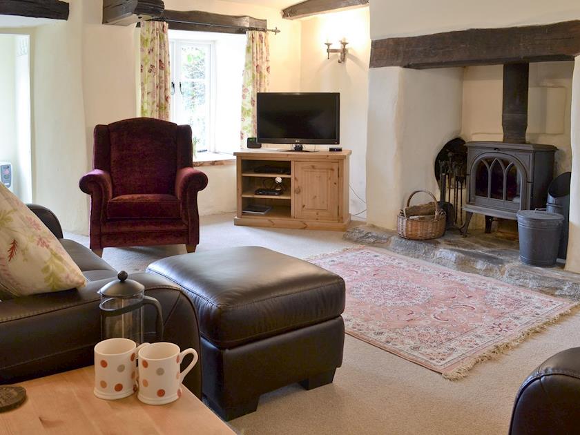 Cosy living room with wood burner | Bee Bowl Cottage, Landcross, near Bideford