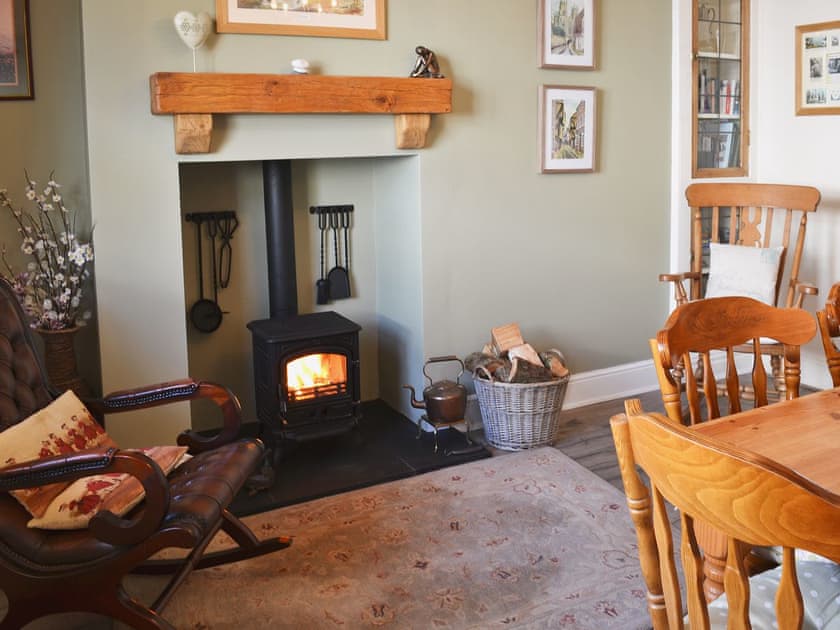 Dining room with log burner | Coble Cottage, Flamborough
