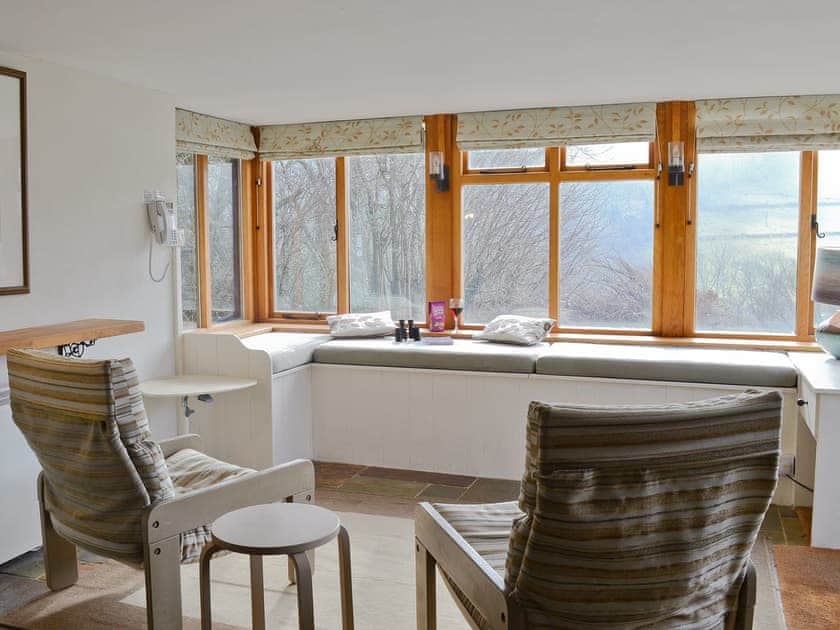seating area and window seats in the bay picture windows | Penroc - Ty Mari-Penroc, Cwmystwyth, Aberystwyth