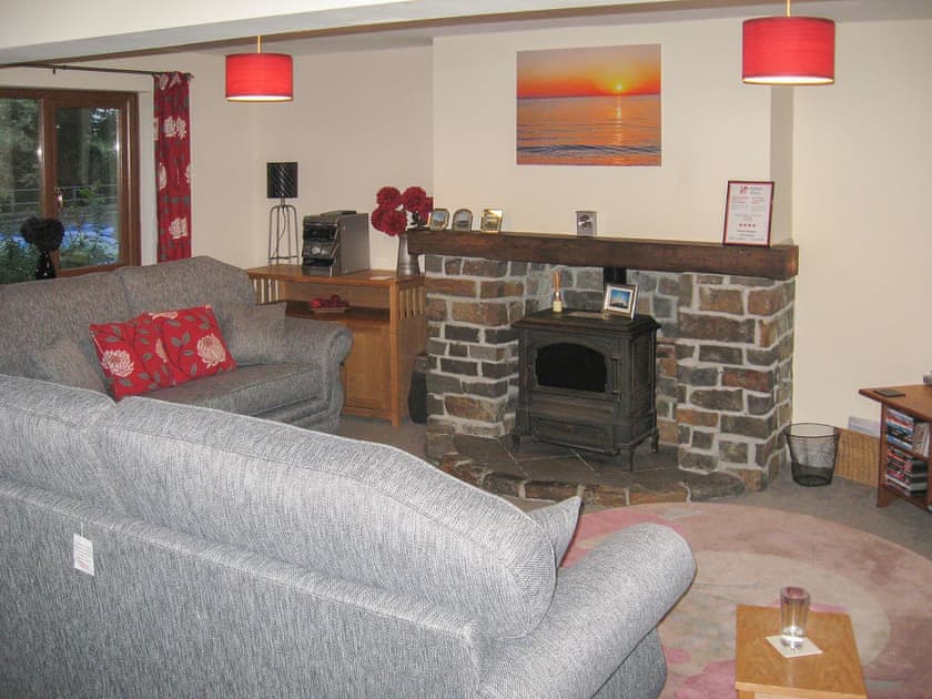 Living room with attractive fireplace | Springer Cottage, Llansteffan