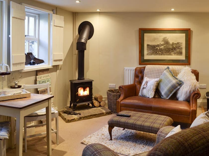 Beautiful cosy cottage interior warmed by a log burning stove | The Old Cobblers Cottage, Bakewell