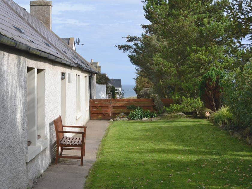 Front of cottage looking along to the sandy beach  | Shelterstone, Elgin