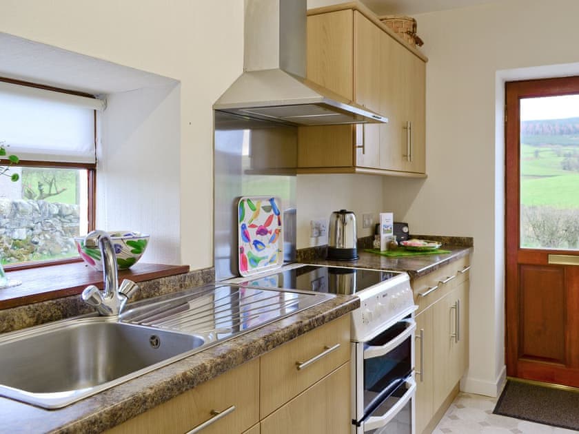 Well-equipped ‘galley-style’ kitchen | Beuchan Cottage - Beuchan Farm, Keir Mill, Thornhill