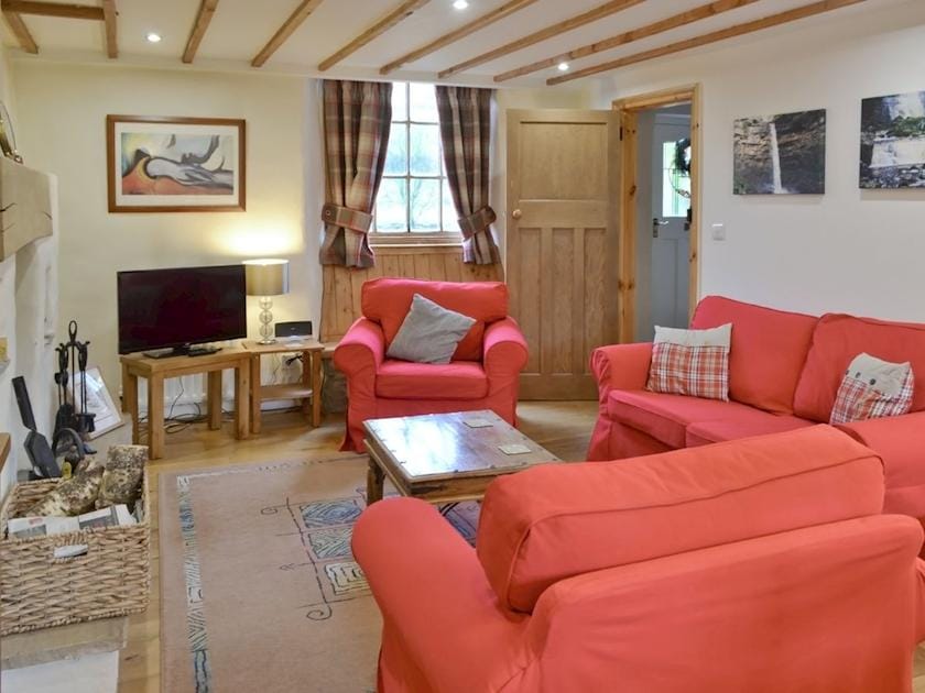 Tasteful country-style living area with wood burning stove | Arngill, Muker