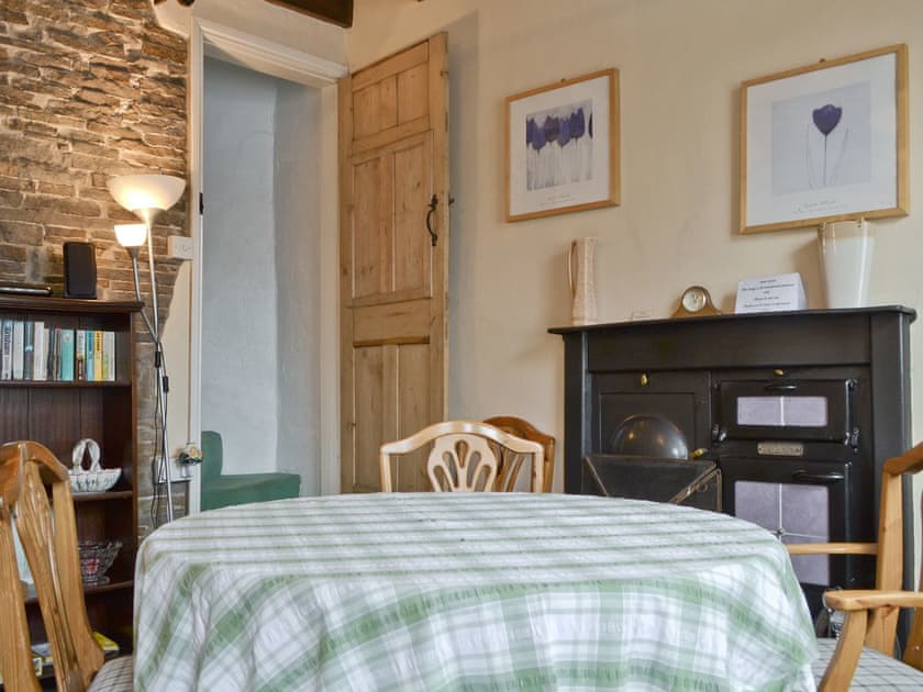 Traditional cast iron range in dining room | Cattlemarket Cottage, Hawes