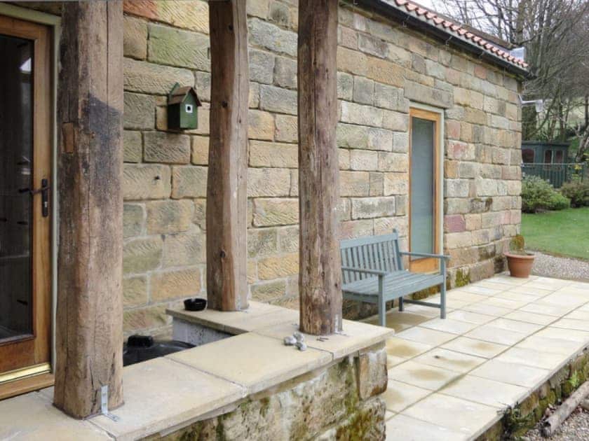 Flagged patio to rear with outdoor seating | Crossbill Cottage, Chopgate near Stokesley