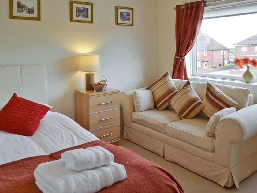 Additional bedroom with comfortable seating | Eastside House, Whitby