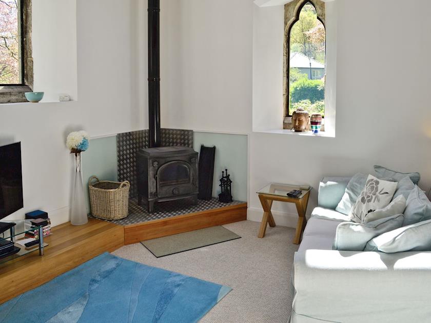 Cosy ground floor living room with wood-burner | St John The Baptist Mission Church, Capel Curig