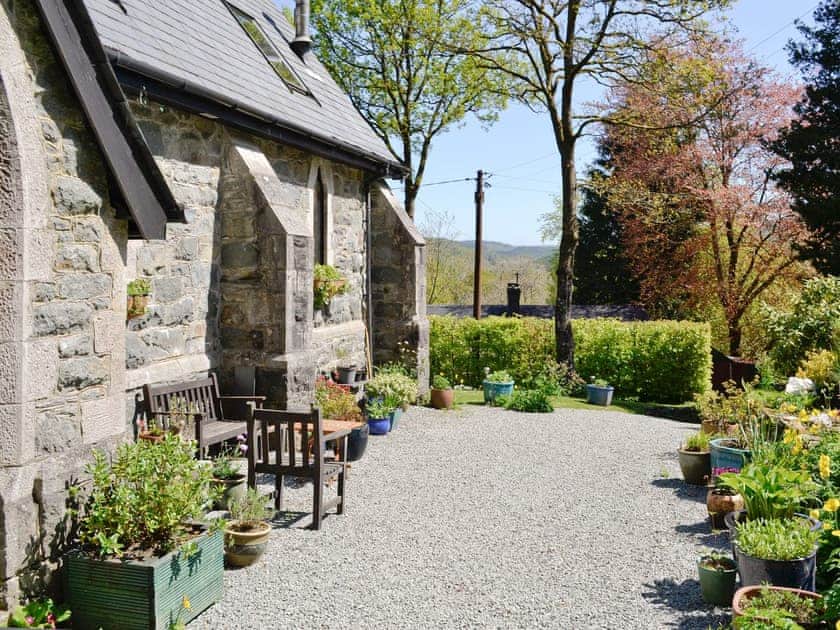 Gravelled patio with sitting out area | St John The Baptist Mission Church, Capel Curig
