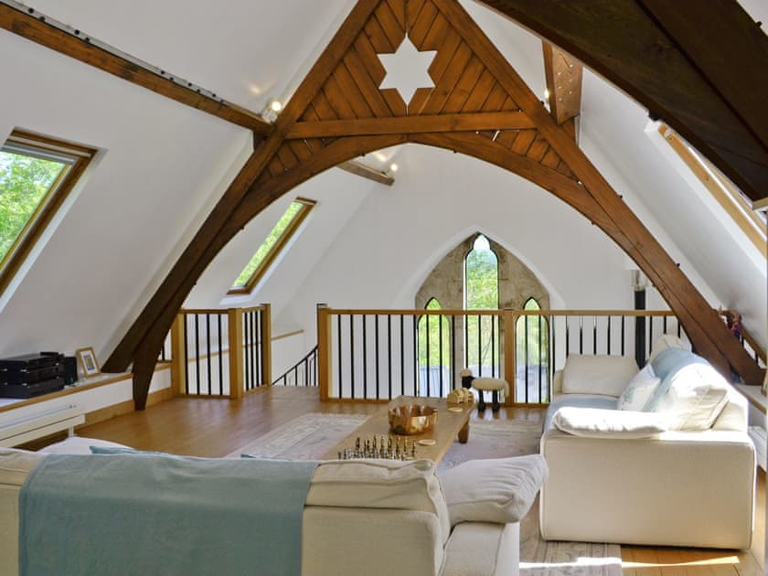First floor lounge area with mezzanine balcony | St John The Baptist Mission Church, Capel Curig