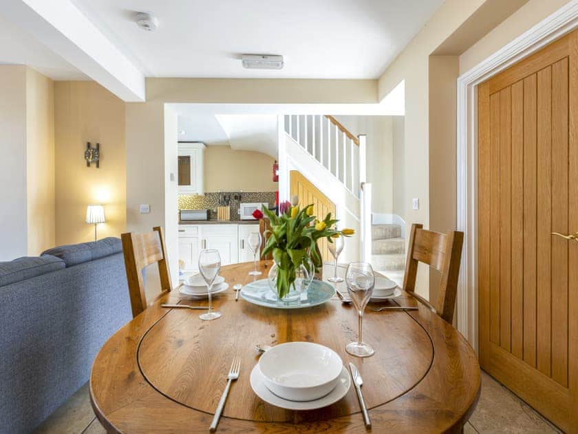 Dining area adjoins lounge and kitchen | Tommy’s Cottage, Keswick