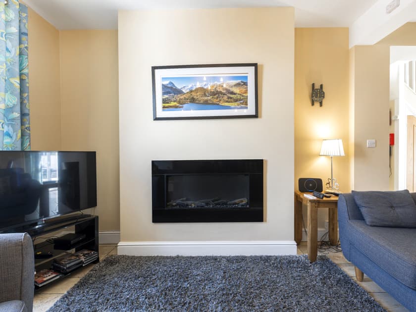 Stylish wall mounted fire | Tommy’s Cottage, Keswick