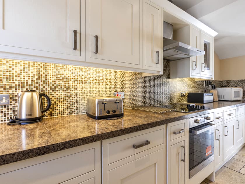 Well-equipped fitted kitchen | Tommy’s Cottage, Keswick