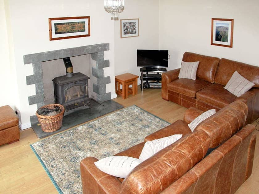 Cosy living room with woodburner | Brookside Cottage, Braithwaite