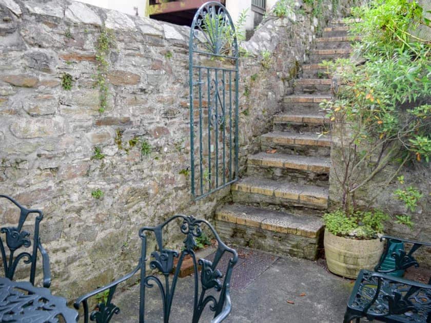 Secluded rear courtyard with outdoor furniture, drying area and BBQ | Caerleon, Salcombe